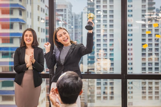 Business woman holding award trophy show victory at meeting room, Celebration success happiness team concepts photo