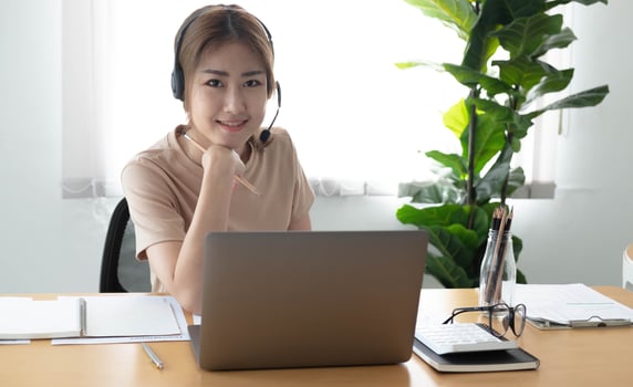 Video call camera view of businesswoman talks actively in videoconference . Call center, telemarketing, customer support agent provide service on telephone video conference call. photo