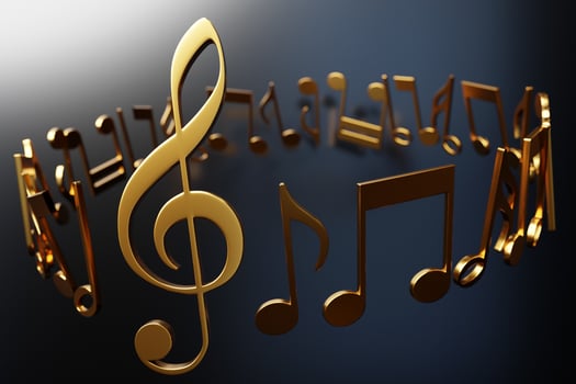 Realistic golden metal treble clef and   musical notes on a black background. 3d golden musical symbol - decoration elements for design. photo