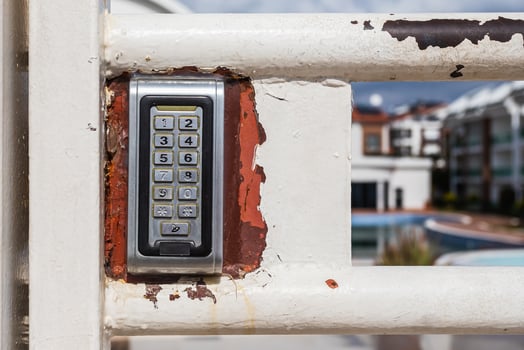 numeric keypad on concrete wall photo