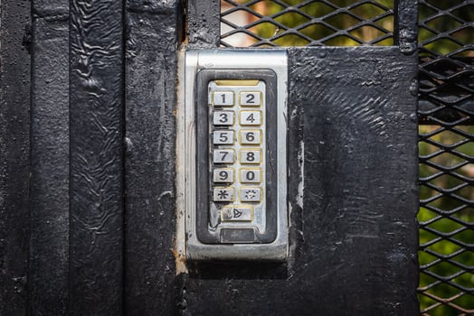 numeric keypad on concrete wall photo