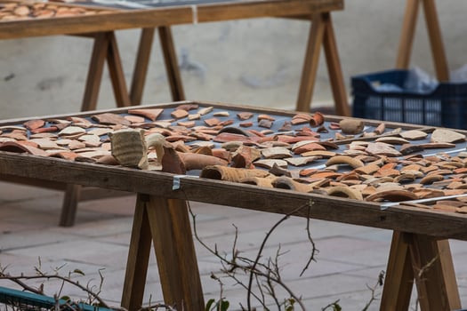 Fragments of ancient ceramics. Artifacts. Archaeological finds. Fragments of old jugs. Archeology. photo