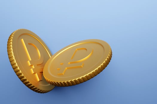 Golden coin with ruble sign isolated on blue background. Income concept. 3D rendering. photo