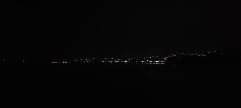 Dark night city view from mountain photo