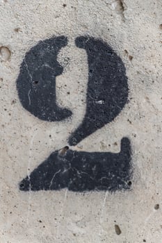 number two painted stencil on concrete wall, number two, number 2 photo