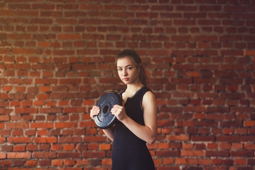 Woman in sportswear doing crossfit photo