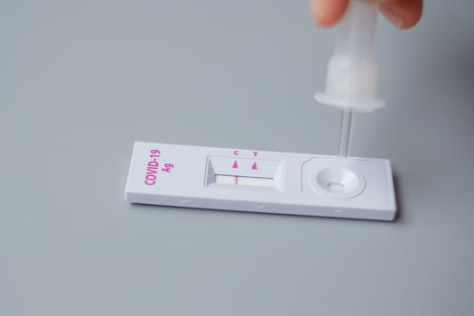 man swab COVID-19 testing by Rapid Antigen Test kit. Coronavirus Self nasal or Home test, Lockdown and Home Isolation concept photo