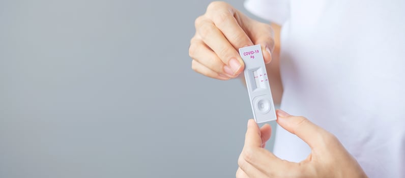man holding Rapid Antigen Test kit with Negative result during swab COVID-19 testing. Coronavirus Self nasal or Home test, Lockdown and Home Isolation concept photo