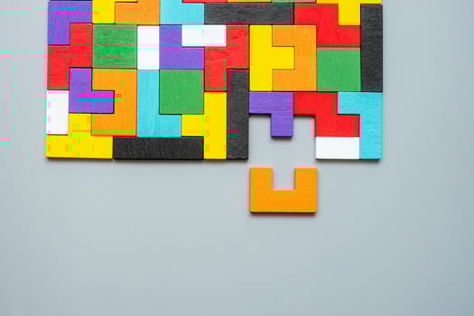 geometric shape block with colorful wood puzzle piece background. logical thinking, business logic, Conundrum, decision, solutions, rational, mission, success, goals and strategy concepts photo