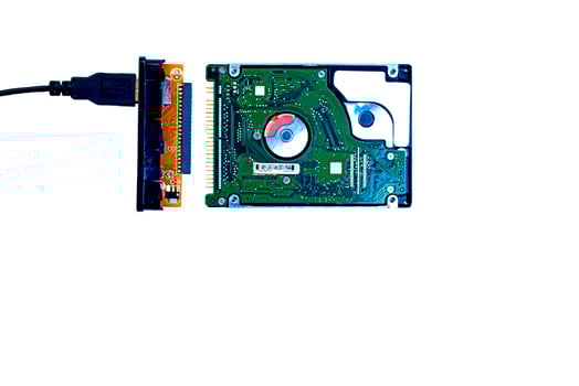 Hard disk IDE and USB adapter on a white background. photo
