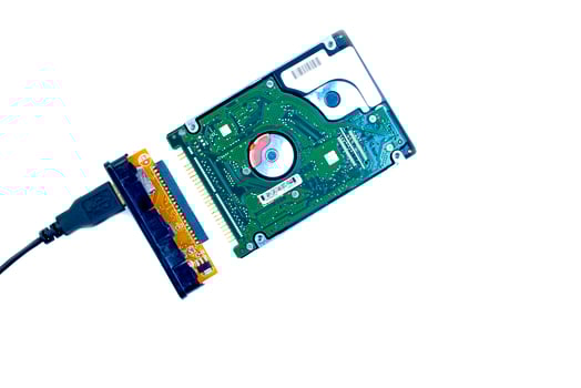 Hard disk IDE and USB adapter on a white background. photo