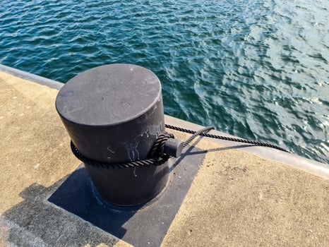 Different bollards in front of the water at the port of kiel. photo
