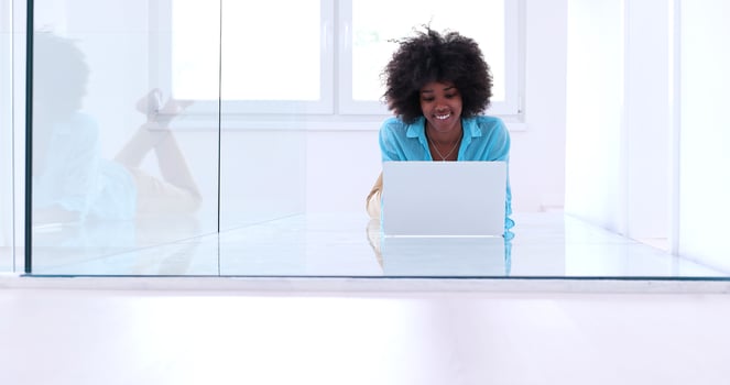 black women using laptop computer on the floor photo