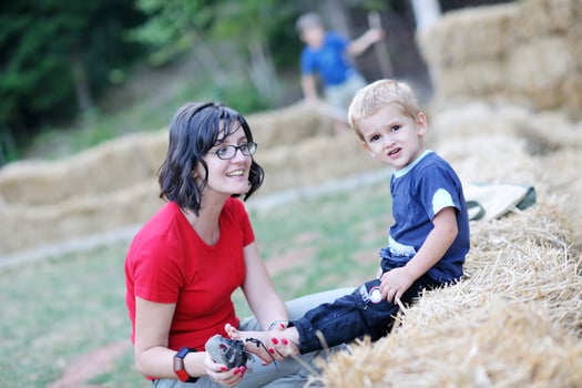 woman and child have fun outdoor photo