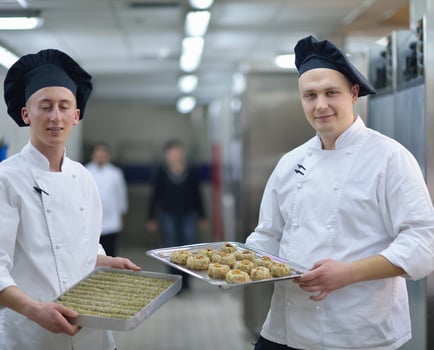 chef preparing desert cake in the kitchen photo