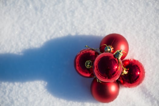 red christmas ball in fresh snow photo