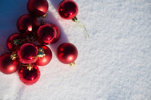 red christmas ball in fresh snow photo