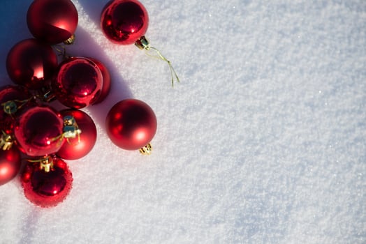 red christmas ball in fresh snow photo