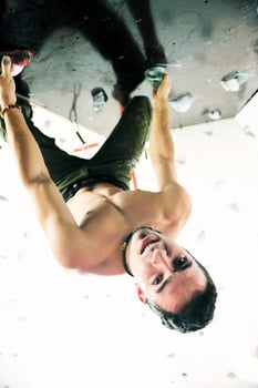 Man rock climbing photo
