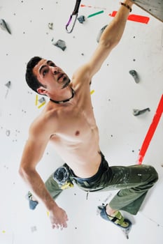 Man rock climbing photo