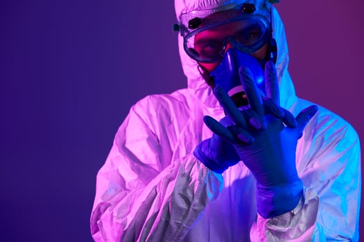 Doctor wearing protective biological suit and mask due to coronavirus photo