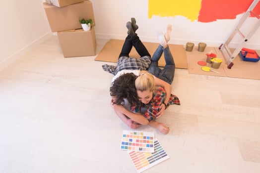 Happy young couple relaxing after painting photo