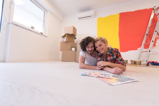 Happy young couple relaxing after painting photo