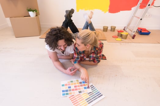Happy young couple relaxing after painting photo
