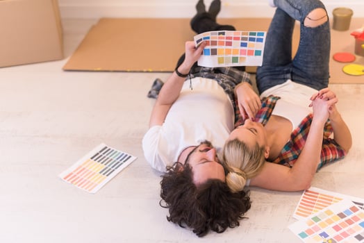 Happy young couple relaxing after painting photo