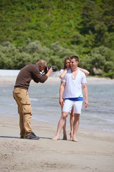 photographer taking photo on beach
