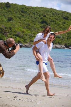 photographer taking photo on beach