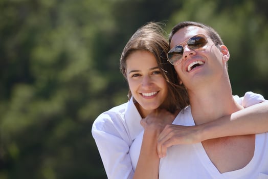 happy young couple have fun on beach photo