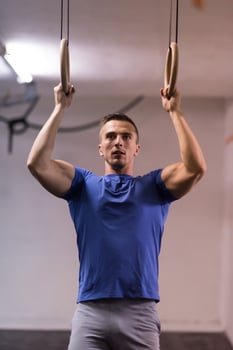 man doing dipping exercise photo