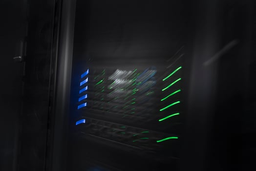 server room or data center supercomputer technology equipment, abstract close up of a server rack with motion blur. photo