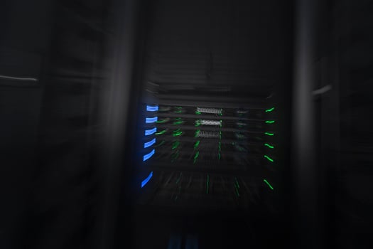 server room or data center supercomputer technology equipment, abstract close up of a server rack with motion blur. photo