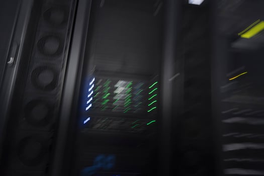 server room or data center supercomputer technology equipment, abstract close up of a server rack with motion blur. photo