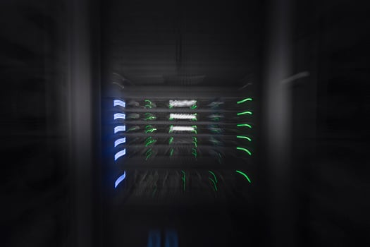server room or data center supercomputer technology equipment, abstract close up of a server rack with motion blur. photo