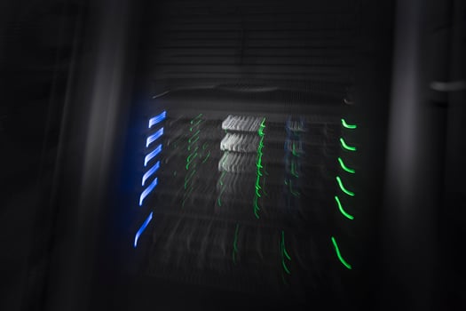server room or data center supercomputer technology equipment, abstract close up of a server rack with motion blur. photo
