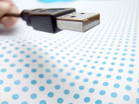 USB cable on dotted background photo