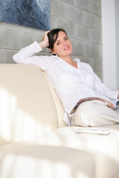 woman reading magazine at home photo