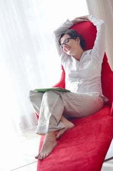 woman using tablet pc at home photo