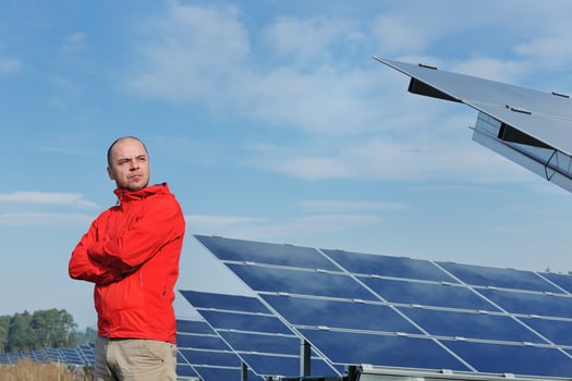 Male solar panel engineer at work place photo
