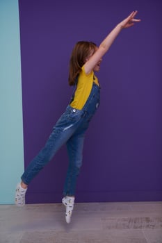 Cute little girl dancing at home photo