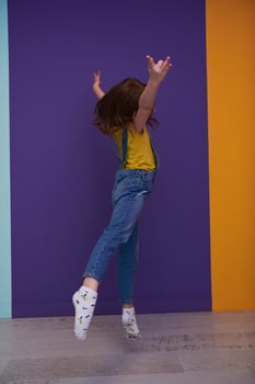 Cute little girl dancing at home photo