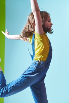 Cute little girl dancing at home photo