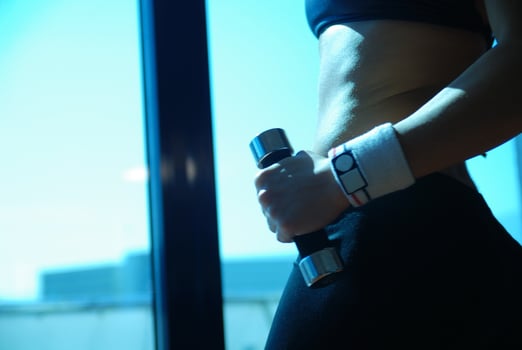 woman doing exercise with dumbbell photo