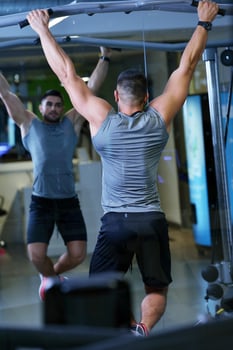 handsome man exercising at the gym photo