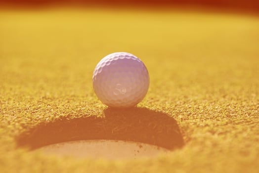 golf ball in the hole photo