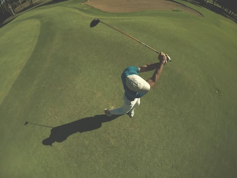 top view of golf player hitting shot photo