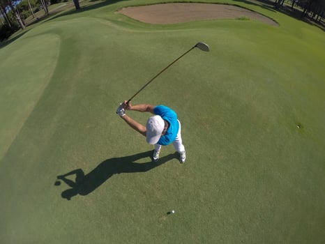 top view of golf player hitting shot photo